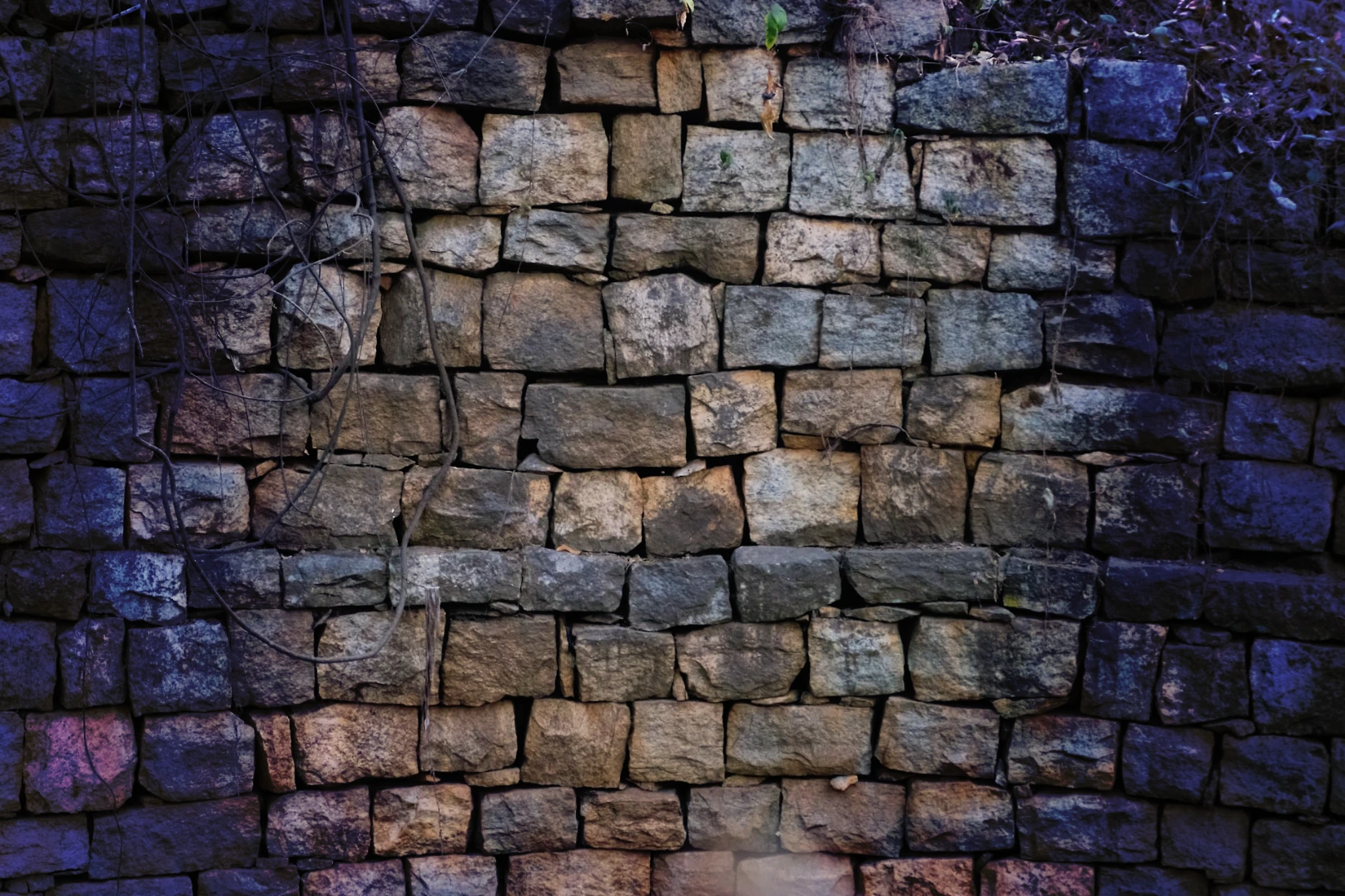 a stone wall made of small rocks